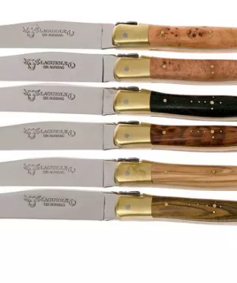 image 1 image 2 image 3 image 4 thumbnail 0 thumbnail 1 thumbnail 2 thumbnail 3 thumbnail 4 Full description This Laguiole en Aubrac six-piece steak knife set will enrich any dining table. The set contains six steak knives with different handle materials and bolsters made from brass with a matt finish. The steak knives are made by hand and nicely finished. Exactly like we have grown accustomed to from this authentic Laguiole brand.  Specifications 1.9 cm  11.5 cm  23.3 cm  90 g  Also popular  Claude Dozorme Laguiole 6-piece Steak knife set without bolster, Olive wood Claude Dozorme Laguiole 6-piece Steak knife set without bolster, Olive wood €161.95 ± 1 month   Laguiole en Aubrac steak knife set 6-piece French woods 2 Reviews Laguiole en Aubrac steak knife set 6-piece French woods €459.10 In stock   Laguiole en Aubrac Quotidien steak knife set 6-piece French woods 2 Reviews Laguiole en Aubrac Quotidien steak knife set 6-piece French woods €316.10 In stock   Forge de Laguiole, T62MINB, steak knife set, horn tip 1 Reviews Forge de Laguiole, T62MINB, steak knife set, horn tip €612.00 In stock   Laguiole en Aubrac steak knife set 6-piece mixed horn, 62C99CKI Laguiole en Aubrac steak knife set 6-piece mixed horn, 62C99CKI €579.00 In stock   Amefa Hercule XXL 4917 three steak knives 5 Reviews Amefa Hercule XXL 4917 three steak knives €19.49 In stock   Claude Dozorme Le Thiers Art Deco steak knife set 6-piece, Juniper Claude Dozorme Le Thiers Art Deco steak knife set 6-piece, Juniper €379.00 In stock   Nisaku Yamagatana Mokuetubatsuki Hori Hori 802, garden knife 8 Reviews Nisaku Yamagatana Mokuetubatsuki Hori Hori 802, garden knife €34.95 In stock   Forge de Laguiole 12110INCABDF, Aubrac-horn 1 Reviews Forge de Laguiole 12110INCABDF, Aubrac-horn €214.00 In stock   Ballistol maintenance oil, 50 ml 166 Reviews Ballistol maintenance oil, 50 ml €8.00 ± 1 month   Specifications General information Brand  Laguiole en Aubrac  Colour  brown, copper, silver, black  Yes  lifetime  France  Article number  AU62C99BDLBH  Dimensions & weight 1.9 cm  11.5 cm  1.9 mm  Handle length  11.7 cm  23.3 cm  90 g  Material Material handle  ebony wood, heather wood, juniper wood, olive wood, Pistaccio wood, snakewood  Type of steel  Sandvik 12c27  58 HRC  Features & functions Blade characteristics  smooth  Finish blade  polished  Dishwasher safe  No  Right or left-handed  symmetrical  Type  steak knife, table knife  plain edge  26º  flat, Secondary V-edge  Type of handle  Western grip  52 degrees  Scope of delivery Delivered as a set  Yes  Including  storagebox  6  Recommended combi-deals  Laguiole en Aubrac Sommelier knife buffalo horn 1 Reviews Laguiole en Aubrac Sommelier knife buffalo horn €156.99 €178.40 -12%  SAVE 21.41    Laguiole en Aubrac Sommelier knife juniper 4 Reviews Laguiole en Aubrac Sommelier knife juniper €148.10 €168.30 -12%  SAVE 20.20    Miyabi by Zwilling 5000MCD Gyutoh, 34373-201 11 Reviews Miyabi by Zwilling 5000MCD Gyutoh, 34373-201 €283.91 €319.00 -11%  SAVE 35.09    Miyabi 6000MCT, 20 cm Gyutoh, 34073-201 by Zwilling 17 Reviews Miyabi 6000MCT, 20 cm Gyutoh, 34073-201 by Zwilling €150.41 €169.00 -11%  SAVE 18.59   Article number AU62C99BDLBH Laguiole en Aubrac - set of 6 steak knives mixed wood